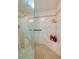Luxurious shower with custom tile work, a built-in bench, and stylish glass doors at 732 Marina Point Dr # 7320, Daytona Beach, FL 32114