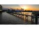 Beautiful sunset water view of the dock with a warm, inviting atmosphere at 732 Marina Point Dr # 7320, Daytona Beach, FL 32114