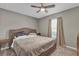 Bedroom featuring a ceiling fan and large windows at 840 Chestnut Ave, Orange City, FL 32763