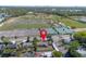 Aerial view of the home and surrounding neighborhood with convenient nearby tennis courts and ball fields at 852 Derbyshire Rd, Daytona Beach, FL 32117