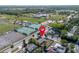 Aerial view of the home and surrounding neighborhood with convenient nearby tennis courts and ball fields at 852 Derbyshire Rd, Daytona Beach, FL 32117