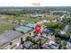 Aerial view of the home and surrounding neighborhood with convenient nearby tennis courts and ball fields at 852 Derbyshire Rd, Daytona Beach, FL 32117