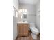 Bathroom featuring a wood vanity and a bright mirror at 852 Derbyshire Rd, Daytona Beach, FL 32117