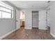 Bedroom with wood flooring, neutral walls, and a closet for ample storage at 852 Derbyshire Rd, Daytona Beach, FL 32117