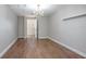 Bright bedroom featuring modern finishes and a spacious layout with wood-look flooring at 852 Derbyshire Rd, Daytona Beach, FL 32117