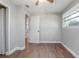 Bedroom featuring wood-look flooring, a ceiling fan, and a window at 852 Derbyshire Rd, Daytona Beach, FL 32117