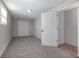Bedroom featuring neutral carpet, closet and wood-look flooring at 852 Derbyshire Rd, Daytona Beach, FL 32117