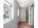 Hallway with wood-look flooring leading to an exterior door and other rooms at 852 Derbyshire Rd, Daytona Beach, FL 32117