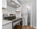 Updated kitchen featuring modern appliances and a convenient, in-unit washer and dryer at 852 Derbyshire Rd, Daytona Beach, FL 32117