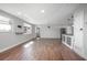Spacious living area with modern finishes, wood floors, and views of the front yard at 852 Derbyshire Rd, Daytona Beach, FL 32117