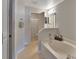 Bright bathroom with a soaking tub, walk-in shower, and neutral color scheme at 3430 Arabesque Dr, Deland, FL 32724