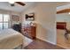 Comfortable bedroom with hardwood floors, TV and a view into the adjacent dining area at 3430 Arabesque Dr, Deland, FL 32724