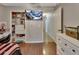 Spacious bedroom with wood floors, walk-in closet and decorative fish tank at 3430 Arabesque Dr, Deland, FL 32724