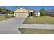 Inviting single-story home with a well-maintained lawn and an attached two-car garage at 3430 Arabesque Dr, Deland, FL 32724