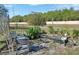 Beautiful water garden with rocks, plants, and seating area, creating a tranquil outdoor oasis at 3430 Arabesque Dr, Deland, FL 32724