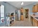 Spacious kitchen with stainless steel refrigerator, storage, and a convenient pantry at 3430 Arabesque Dr, Deland, FL 32724