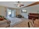Cozy living room with sliding glass doors, comfortable seating, and a stylish entertainment area at 3430 Arabesque Dr, Deland, FL 32724
