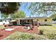 A spacious backyard with fire pit and grill, perfect for entertaining and enjoying the outdoor space at 10 Lilac Dr, Debary, FL 32713