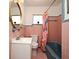 Retro bathroom featuring pink tiling, a colorful shower curtain, and a modern vanity at 10 Lilac Dr, Debary, FL 32713