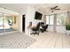 Spacious bonus room with tile flooring, ceiling fan, and a workstation for multiple computers at 10 Lilac Dr, Debary, FL 32713