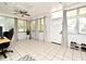 Bright bonus room with tile flooring, large windows, and a ceiling fan at 10 Lilac Dr, Debary, FL 32713
