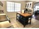 Bright kitchen showcasing an island, white cabinetry, and modern appliances, ideal for culinary adventures at 10 Lilac Dr, Debary, FL 32713