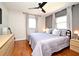 Comfortable main bedroom with hardwood floors, plenty of natural light, and modern furnishings creating a serene retreat at 10 Lilac Dr, Debary, FL 32713