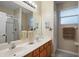 This bathroom features a double sink vanity, walk-in shower, and decor for a fresh look at 104 W Lake Victoria Cir, Deland, FL 32724