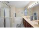 This bright bathroom features a double vanity, shower, and tub to create a relaxing space at 104 W Lake Victoria Cir, Deland, FL 32724