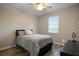 This bedroom includes a window to let in natural light and ceiling fan to circulate the air at 104 W Lake Victoria Cir, Deland, FL 32724