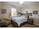 This is a decorated bedroom with a ceiling fan, closet, window, and decor to enjoy at 104 W Lake Victoria Cir, Deland, FL 32724