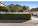 Exterior shot of the home with manicured landscaping, a white privacy fence and long paved driveway at 104 W Lake Victoria Cir, Deland, FL 32724