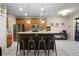 Spacious kitchen with a large island, stainless steel appliances, and barstool seating at 104 W Lake Victoria Cir, Deland, FL 32724