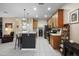 Open kitchen featuring center island with bar stools, appliances, and ample counter space at 104 W Lake Victoria Cir, Deland, FL 32724