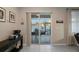 Bright living area with sliding doors opening to a screened patio at 104 W Lake Victoria Cir, Deland, FL 32724