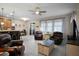 Spacious living room showcasing tile floors, comfortable seating, and natural light at 104 W Lake Victoria Cir, Deland, FL 32724