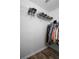 This walk-in closet has hardwood floors, wire shelving, and hanging rods for a clean, organized space at 104 W Lake Victoria Cir, Deland, FL 32724