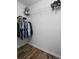 This well-organized walk-in closet features hardwood floors and wire shelving for ample storage at 104 W Lake Victoria Cir, Deland, FL 32724