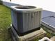 Well-maintained AC unit on a concrete platform at 112 Grande Lake Dr, Daytona Beach, FL 32124