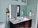 Bathroom featuring double vanity, mirror and decor at 112 Grande Lake Dr, Daytona Beach, FL 32124
