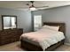 Cozy bedroom featuring furnishings and ceiling fan at 112 Grande Lake Dr, Daytona Beach, FL 32124