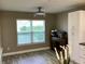 Bright Dining area with natural light, modern fan, and tile floors at 112 Grande Lake Dr, Daytona Beach, FL 32124