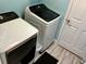 Convenient laundry area equipped with modern washer and dryer units for easy chores at 112 Grande Lake Dr, Daytona Beach, FL 32124