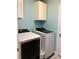 Convenient laundry area equipped with modern washer and dryer units for easy chores at 112 Grande Lake Dr, Daytona Beach, FL 32124