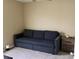 Living room with a comfortable couch, carpeted floors, and great lighting at 112 Grande Lake Dr, Daytona Beach, FL 32124