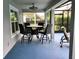 Covered patio space with table and chairs at 112 Grande Lake Dr, Daytona Beach, FL 32124