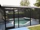 Enclosed pool area featuring clear screen to show the yard beyond at 112 Grande Lake Dr, Daytona Beach, FL 32124