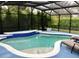 Beautiful screened-in pool area perfect for relaxing and entertaining outdoors at 112 Grande Lake Dr, Daytona Beach, FL 32124