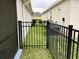 Gated access to side yard and utilities at 112 Grande Lake Dr, Daytona Beach, FL 32124