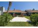 Private backyard with patio, manicured lawn, and mature landscaping at 120 Black Duck Cir, Daytona Beach, FL 32119